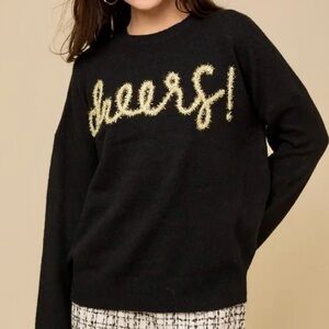 New with tags. Black cheers sweater with gold tinsel lettering. Super soft.